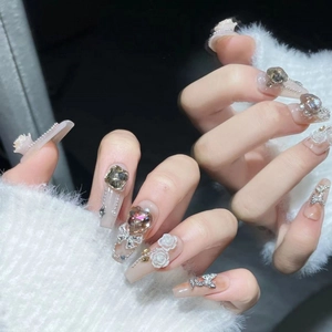 Handcrafted luxury press-on nails with 3D white roses and champagne gemstones