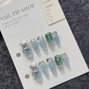French style blue gradient press-on nails with luxury emerald stones and silver bows
