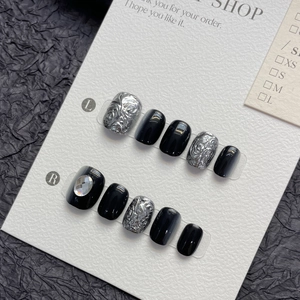Handmade short square press-on nails in black with silver 3D relief and crystal accent