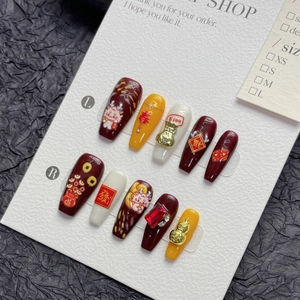 Handmade Chinese New Year press-on nails with 3D dragon and lucky bag festive designs