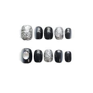 Handmade press-on nails featuring black gloss finish and 3D silver fluid relief accents