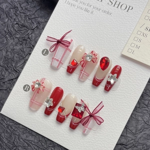French style red and cream long press-on nails with 3D bows and glittery heart crystals