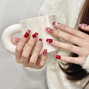 Handmade red and white plaid press-on nails with 3D bow and rhinestones on long ballet shape