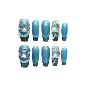 Blue cat-eye press-on nails with luxury square rhinestones and silver chain accents