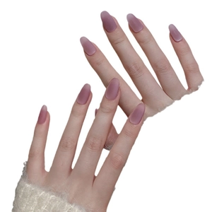 Velvet mauve cat-eye press-on nails in oval shape with a soft matte finish on hands