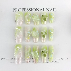 Detail of green gradient press-on nails with 3D roses, pearls and glitter accents