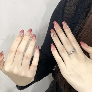 Pink gradient cat-eye press-on nails with silver rhinestones in mid-long coffin shape