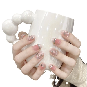 Pink gradient press-on nails with rhinestones and white hand-painted lines for women