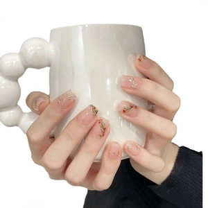 Handmade nude pink square press-on nails with red berry and green leaf floral art