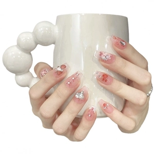 Pink press-on nails with My Melody character, 3D hearts and rhinestones on white cup