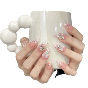 Handmade pink cat-eye coffin press-on nails with 3D bows, rhinestones and heart charms