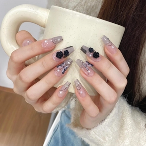 Pink and grey gradient press-on nails with black 3D roses, butterflies, and pearl accents