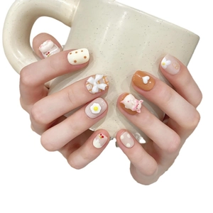 Handmade piglet press-on nails with 3D art accents and cute macaron style motifs