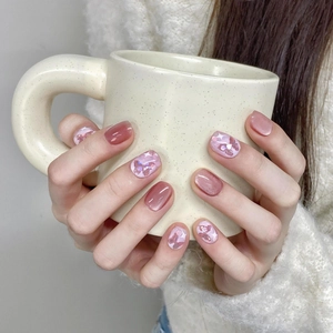 Pink purple cat-eye press-on nails with 3D butterfly accents in short round style