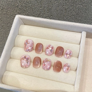 Short handmade press-on nails with pink glitter, Aurora butterfly, and cat-eye finish