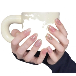 Jelly pink press-on nails with golden relief butterflies and sparkling glitter accents