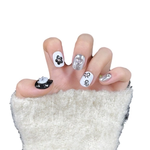 Handmade press-on nails featuring cute 3D cat heads and metallic stars in black and silver