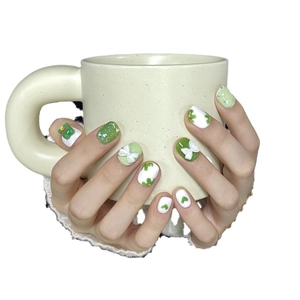 Handmade green frog press-on nails with 3D bows and floral patterns in short round shape