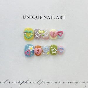 Handmade 10pcs press-on nails with colorful 3D heart and star designs on white card