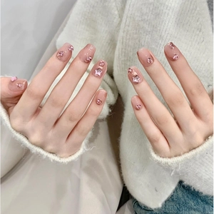 Handmade press-on nails with jelly pink blush design, sparkling rhinestones and star charms