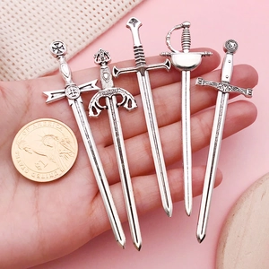 Set of five vintage silver sword pendants for DIY jewelry and medieval hair accessories