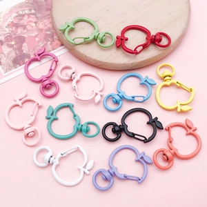 Macro shot of colorful apple-shaped zinc alloy lobster clasps with smooth spray paint finish