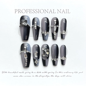 Handmade dark-style press-on nails with black cat-eye gradient and silver charms