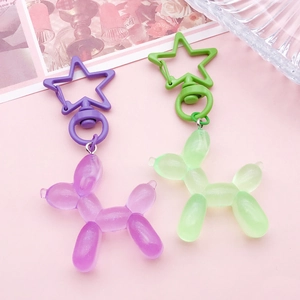 Zinc alloy balloon dog keychains in purple and green with star-shaped metal spring clips