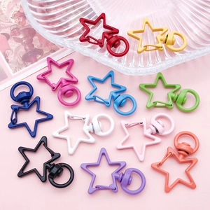 Flat lay of star-shaped swivel lobster clasps in eleven vibrant candy colors for DIY