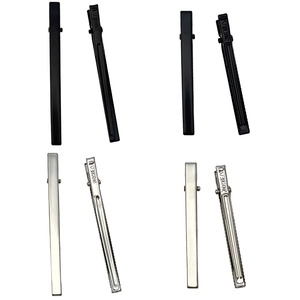 Flat lay of silver and matte black metal alligator hair clips in long and short sizes