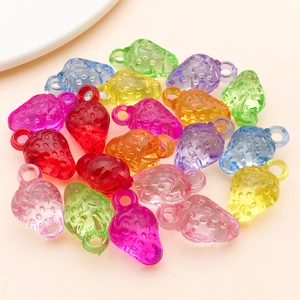 Macro view of translucent strawberry acrylic charms in mixed candy colors for DIY jewelry
