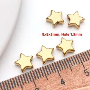 Λήψη macro χρυσών χαντρών αστέρι 8x8x3mm με οπή 1,5mm για χειροποίητα κοσμήματα