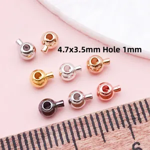DIY copper jewelry crimp beads in gold silver and rose gold with measuring scale