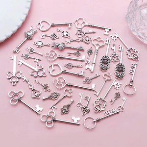 Collection of vintage antique silver skeleton keys with heart and crown designs for DIY jewelry
