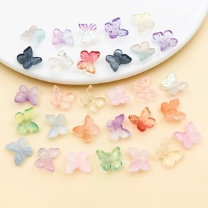 Macro shot of colorful frosted gradient glass butterfly beads for DIY jewelry making