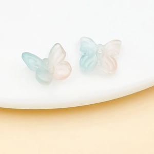 Macro shot of translucent gradient butterfly beads for DIY jewelry and hair accessories