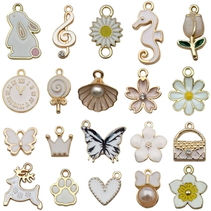 Lot de 20 breloques en émail blanc motifs lapins et fleurs pour la création de bijoux DIY