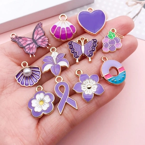 Purple DIY enamel charm set including butterfly heart and flower shapes with gold finish