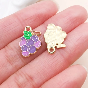 Detail of purple grape enamel charms with gold plating for DIY jewelry making