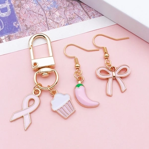 Pink ribbon cupcake pendant and bow enamel earrings set with gold plating finish