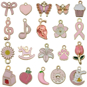Pink enamel charm set for DIY jewelry making featuring flowers, donuts and cute animals
