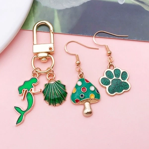 Golden alloy mermaid shell keychain with green clover cat claw mushroom charms set