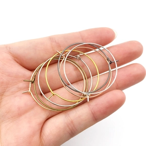Macro detail of round DIY earring hoops in gold, silver, rose gold and bronze finishes