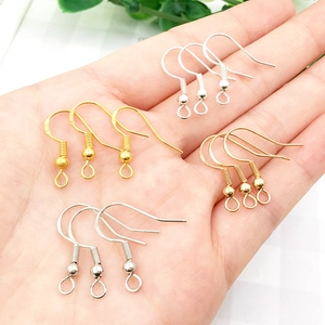 Detailed macro of S925 sterling silver ear hooks in gold and silver finish for DIY jewelry