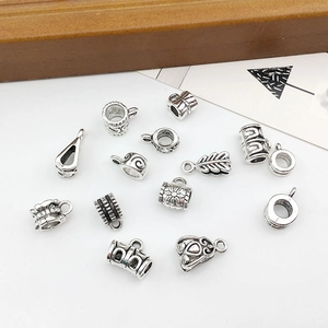 Macro shot of antique silver alloy charms and beads for DIY jewelry making sets