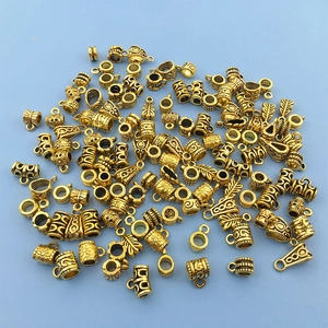 Macro view of antique gold alloy beads and connectors for DIY jewelry making