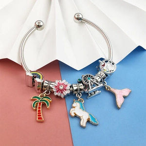Silver charm bracelet with rainbow, unicorn and palm tree enamel pendants and crystals