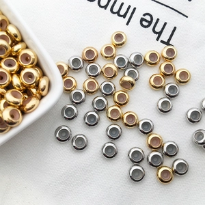 Detail of gold and silver non-slip positioning beads with silicone inserts for jewelry