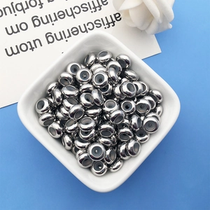 Macro shot of silver slider beads with silicone inserts for adjustable jewelry making
