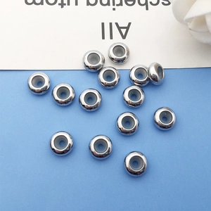 Detailed macro of silver anti-slip spacer beads with silicone lining for jewelry making